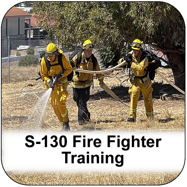 S-130 Fire Fighter Training. Three fire firefighters carrying a hose while spraying water into vegetation. View course infromation